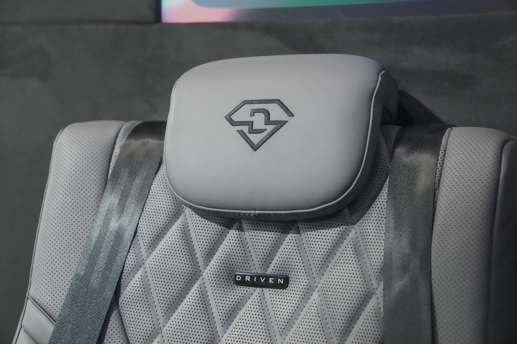 Quilted leather headrest with embroidered detailing